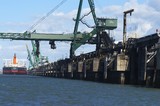 Mining Photo Stock Library - close up photo of ship loader loading coal into ship at wharf.  shot from water level behind the ship. ( Weight: 1  New Image: NO)