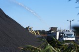 Mining Photo Stock Library - water cart spraying water onto coal stockpile to reduce dust suppression. ( Weight: 1  New Image: NO)