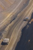 Mining Photo Stock Library - two haul trucks on haul access road in open cut mine site.  aerial vertical photo. ( Weight: 1  New Image: NO)