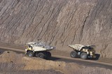 Mining Photo Stock Library - Two loaded haul trucks pass on haul road in open cut coal mine. Queensland Bowen Basin ( Weight: 1  New Image: NO)