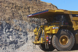 Mining Photo Stock Library - close up photo of yellow haul truck in open cut coal mine with coal high walls behind. ( Weight: 1  New Image: NO)