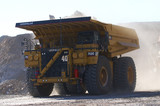Mining Photo Stock Library - haul truck loaded with overburden shot head on with excavator in background.  open cut coal mine. ( Weight: 1  New Image: NO)