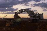 Mining Photo Stock Library - excavator loading overburden into a haul truck in an open cut coal mine.  late afternoon dusk image. ( Weight: 1  New Image: NO)