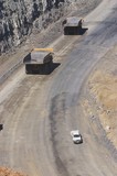 Mining Photo Stock Library - light vehicle passing two 2 haul trucks on access road in open cut coal mine.  aerial photo. ( Weight: 1  New Image: NO)