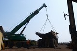 Mining Photo Stock Library - crane lifting a tray onto a haul truck at the mine site workshop.  worker in full PPE observing.  shot from ground level. ( Weight: 1  New Image: NO)