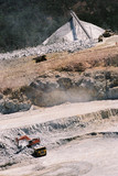 Mining Photo Stock Library - aerial photo of haul trucks being loaded in open cut mine site.  product stockpile in background. ( Weight: 1  New Image: NO)