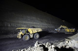 Mining Photo Stock Library - night time photo of truck and digger in open cut coal mine. loaded truck is moving. high wall and coal seam in background. ( Weight: 1  New Image: NO)
