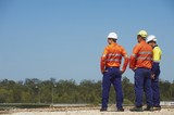 Mining Photo Stock Library - three mine site workers in full PPE in discussion.  great generic photo for double page spread with room for copy. ( Weight: 1  New Image: NO)