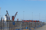Mining Photo Stock Library - photo of temporary fencing around ship at port.  shipping containers stacked on wharf.  bluer sky behind. ( Weight: 1  New Image: NO)