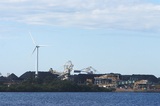 Mining Photo Stock Library - great photo of a large wind generator and in the background is a reclaimer loading stockpiles of coal.  large dam in foreground. ( Weight: 1  New Image: NO)