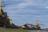 Mining Photo Stock Library - photo of large shiploader and reclaimer working on coal stockpiles. light vehicle sealed road in foreground ( Weight: 1  New Image: NO)