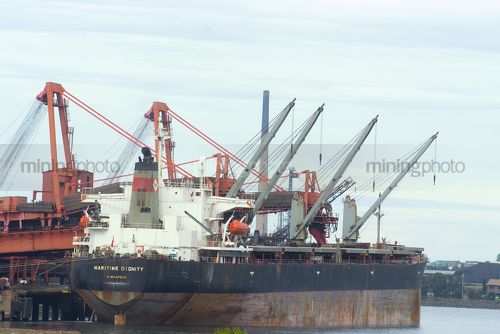 Empty ship in port waiting to be loaded - Mining Photo Stock Library