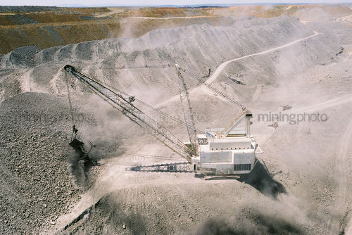 Dragline removes overburden and stockpiles in huge open cut coal mine in Queensland. - Mining Photo Stock Library
