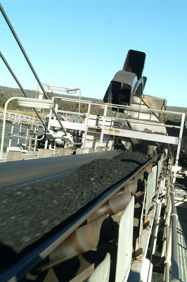 Moving conveyor on coal loader - Mining Photo Stock Library
