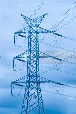 Electricity tower with cables.  blue wash through image. - Mining Photo Stock Library