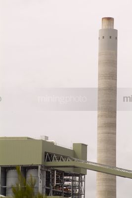 Smokestyck at power station close up.  coal conveyors and plant adjacent.   - Mining Photo Stock Library