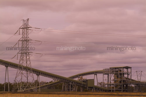 Power station with coal conveyors adn electricity tower. shot at sunset.  good panorama image. - Mining Photo Stock Library
