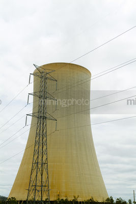 Cooling tower at power station with electricty tower in front. - Mining Photo Stock Library
