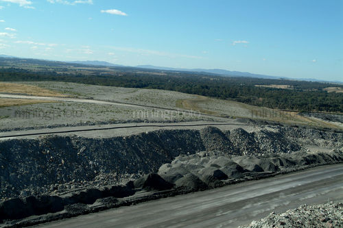 Open cut coal mine.  haul road with overburden stockpiles. - Mining Photo Stock Library
