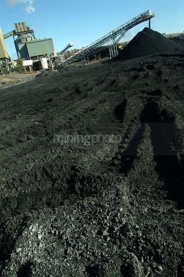 Coal wash plant with loader tracks in stockpile.  good generic shot with room for text in foreground. verical shot - Mining Photo Stock Library