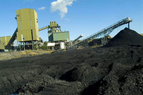 Coal wash plant with loader tracks in stockpile.  good generic shot with room for text in foreground. - Mining Photo Stock Library