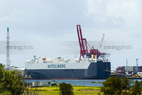 Car ship transport loading at wharf. - Mining Photo Stock Library