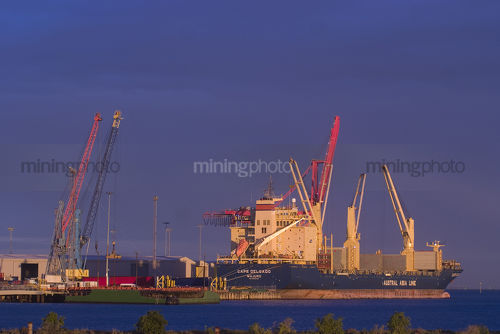 Ship in port being loaded for export - Mining Photo Stock Library