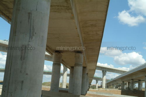 Freeway overpass during construction - Mining Photo Stock Library