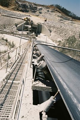 Photo taken at top of stockpile conveyor looking back to open cut mine  - Mining Photo Stock Library