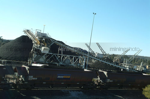 Reclaimer and coal loader at rail terminal and wash plant. - Mining Photo Stock Library