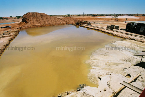 Warter dam on remote mine site. - Mining Photo Stock Library