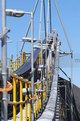 Looking along coal conveyor.  vertical image. - Mining Photo Stock Library