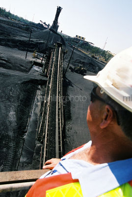 Project manager overseeing coal conveyor - Mining Photo Stock Library