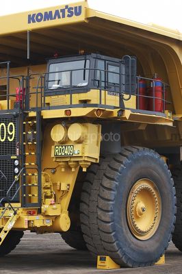 Close up of haul truck at go line with wheel chock - Mining Photo Stock Library