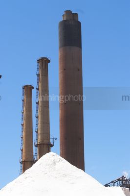 Vapour stacks on mine site.  vertical image. - Mining Photo Stock Library