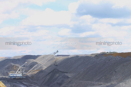 Dragline shifting overburden in open cut coal mine. - Mining Photo Stock Library
