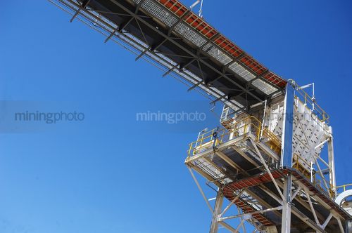 Electric cabling up high on conveyor platform - Mining Photo Stock Library
