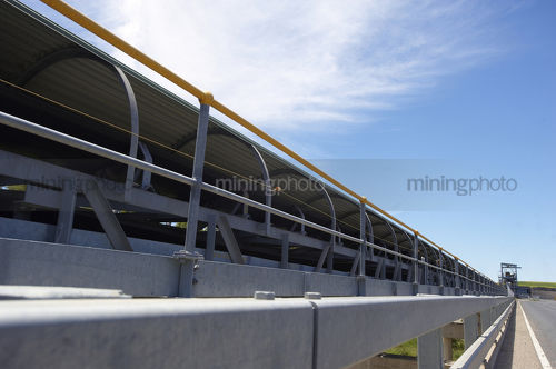Overland coal conveyor - Mining Photo Stock Library