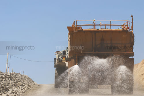 Waterart haul truck on haul road - Mining Photo Stock Library