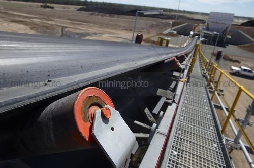 Up close looking down walkway of a new coal conveyor. - Mining Photo Stock Library