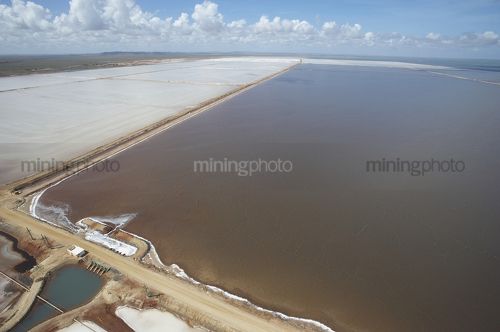 Aerial shot of large salt lakes, some still with water.   - Mining Photo Stock Library