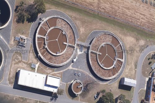 Vertical, aerial shot of water treatment plant. - Mining Photo Stock Library