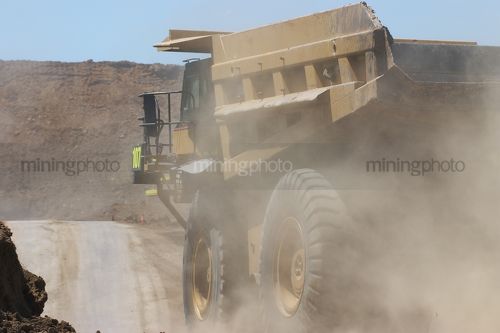 Haul truck moving along haul road in open cut mine. - Mining Photo Stock Library