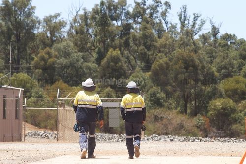 Mine workers in full PPE walking. - Mining Photo Stock Library