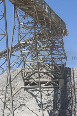 Gold stacker in open cut mine.  blue sky behind. - Mining Photo Stock Library