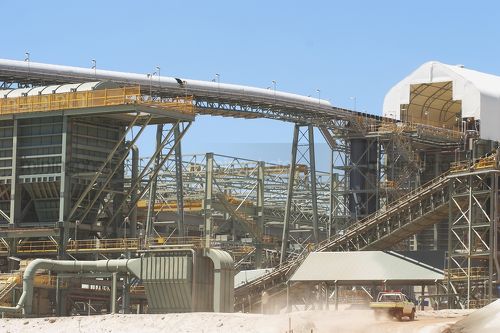 Multi level gold processing plant.  light vehicle in foreground to give scale on just how big this plant is.  great double page spread shot. - Mining Photo Stock Library