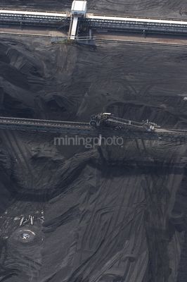 Aerial photo of stockpiled coal at shipping terminal. vertical image. - Mining Photo Stock Library