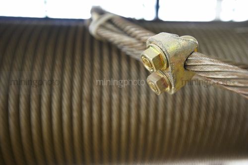 Close up of a roll of wire cable with hitching swage in focus - Mining Photo Stock Library