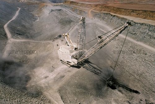 Aerial photo of dragline moving overburden in open cut coal mine. access roads - Mining Photo Stock Library