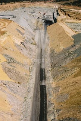Vertical aerial photo of haul access road in open cut coal mine - Mining Photo Stock Library